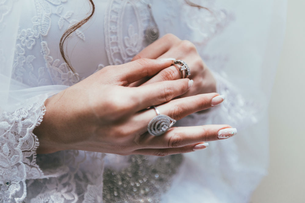 Women Hands Wearing Multiple Rings