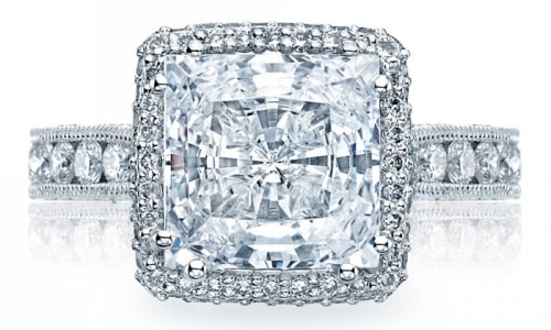 a RoyalT halo engagement ring from Tacori with a princess cut diamond.