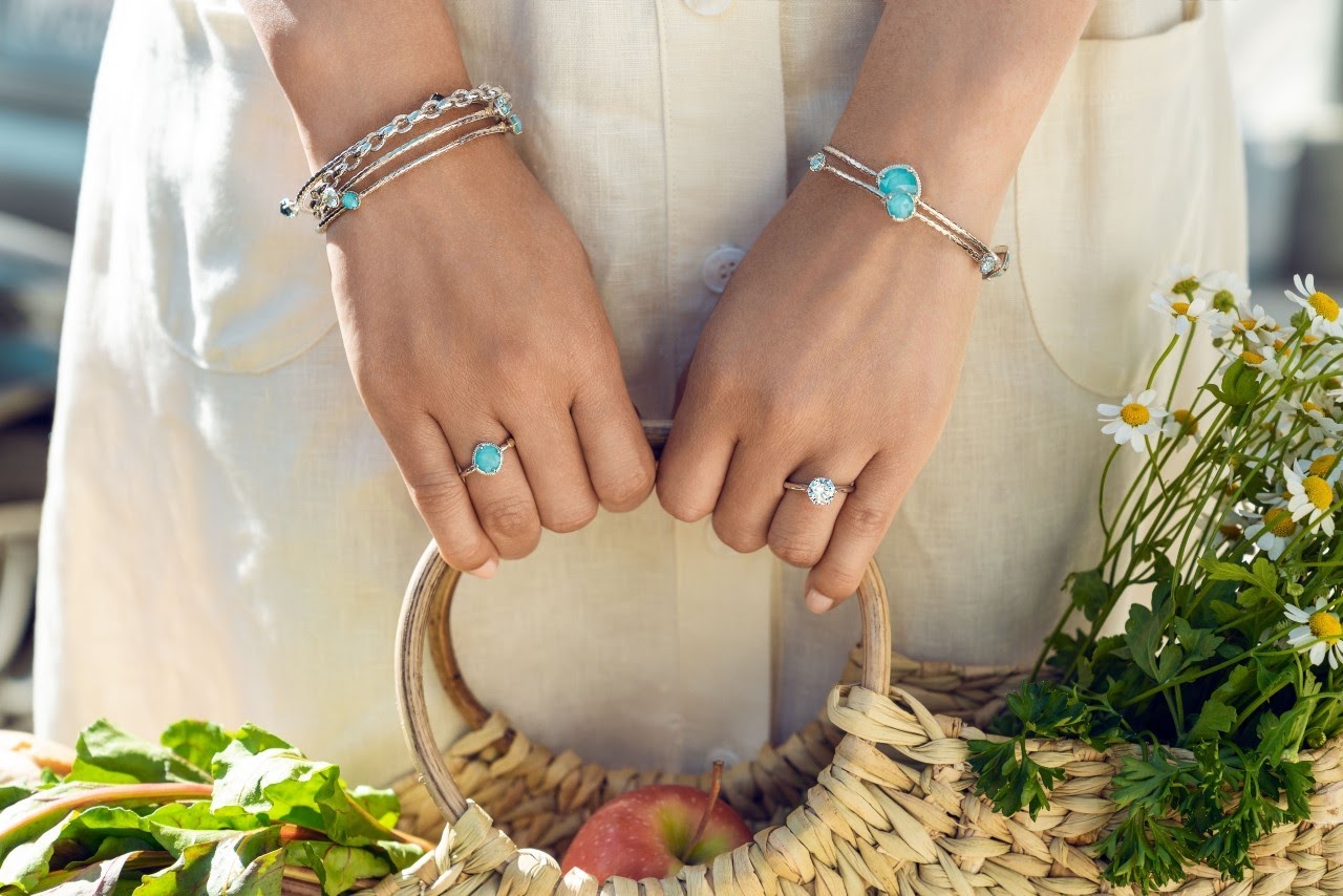 woman with gemstone bracelets