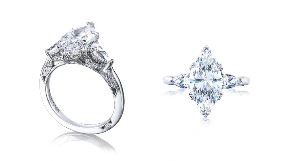 Two angles of a TACORI RoyalT engagement ring with a three stone setting using marquise cut diamonds