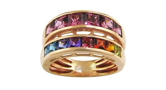 A split bang, rose gold ring featuring a variety of colorful gems