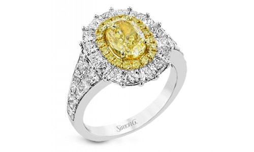 Engagement ring by Simon G. with a prominent yellow center diamond
