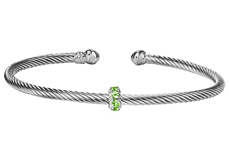 This Phillip Gavriel cuff bracelet features a small peridot charm and cable-like texture