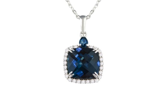 A white gold pendant necklace featuring a large London Blue topaz and accent diamonds