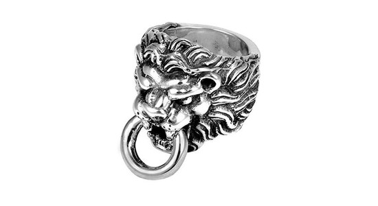 A chunky, silver ring that looks like a lion’s head door knocker
