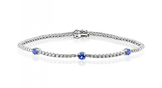 A delicate white gold bracelet set with sapphires and diamonds