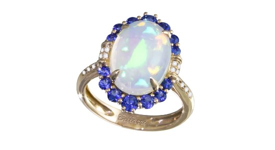 A yellow gold fashion ring featuring an opal center stone surrounded by sapphires and diamonds