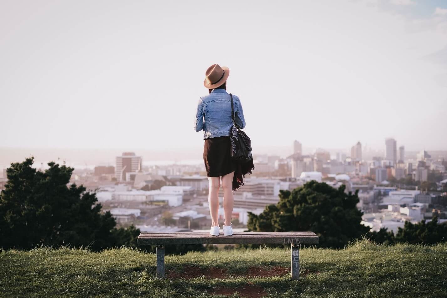 Young Woman in Denim Overlooking the City